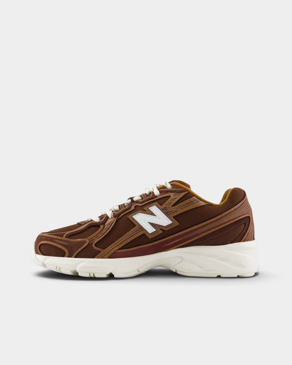New Balance 740v2 Shoes in Pumpernickel/Sea Salt, pair from the inner side: brown upper with caramel and burgundy piping and a white N logo over a cream midsole