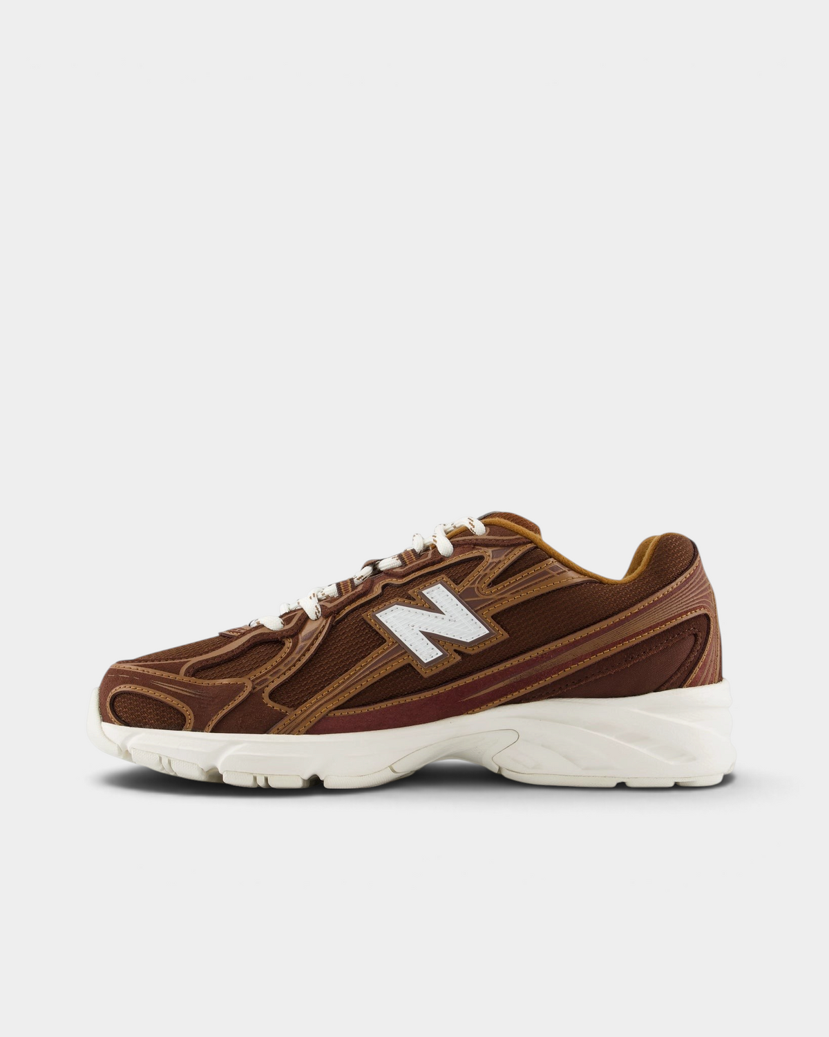 New Balance 740v2 Shoes in Pumpernickel/Sea Salt, pair from the inner side: brown upper with caramel and burgundy piping and a white N logo over a cream midsole