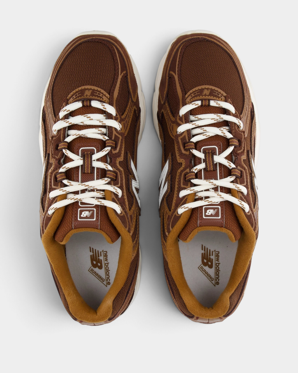 New Balance 740v2 Shoes in Pumpernickel/Sea Salt, pair from above with cream laces over a brown mesh upper and caramel tongue and collar lining