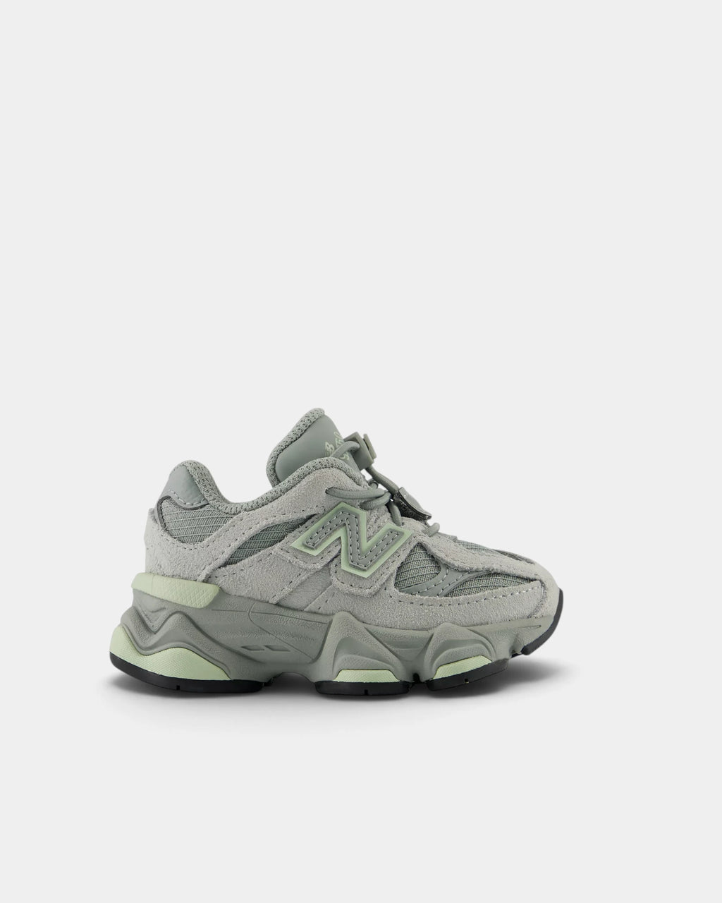 Lockwood Avenue New Balance 9060 Bungee toddler shoe in bayberry green suede and mesh, side view showing the pale green N and the sculpted grey midsole
