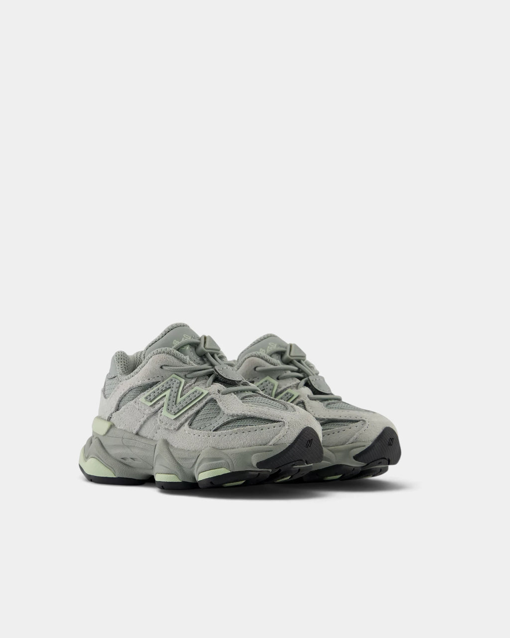 Lockwood Avenue New Balance 9060 Bungee toddler shoes in bayberry green, angled front view of the pair with the bungee lace and its toggle across the tongue
