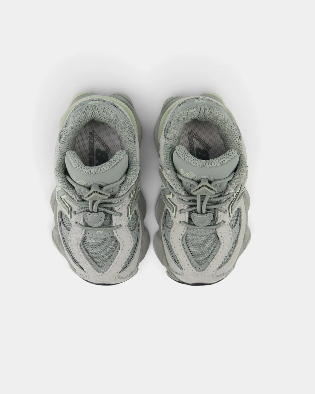 Lockwood Avenue New Balance 9060 Bungee toddler shoes in bayberry green seen from above, both bungee laces and the padded collars in view