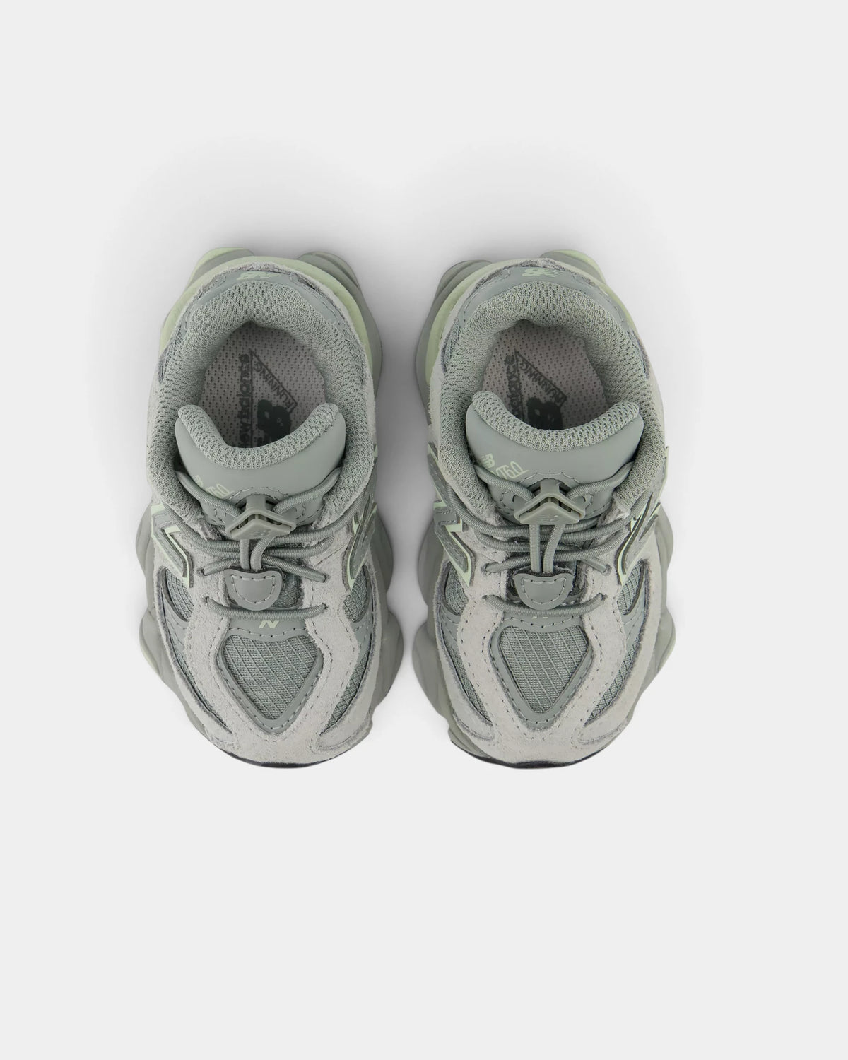 Lockwood Avenue New Balance 9060 Bungee toddler shoes in bayberry green seen from above, both bungee laces and the padded collars in view