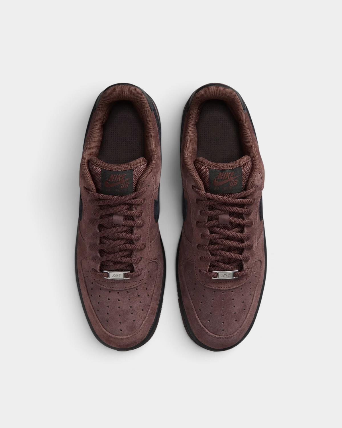Lockwood Avenue Nike SB Air Force 1 Light Chocolate skate shoes seen from above, brown laces and brown suede tongues with the Nike SB label