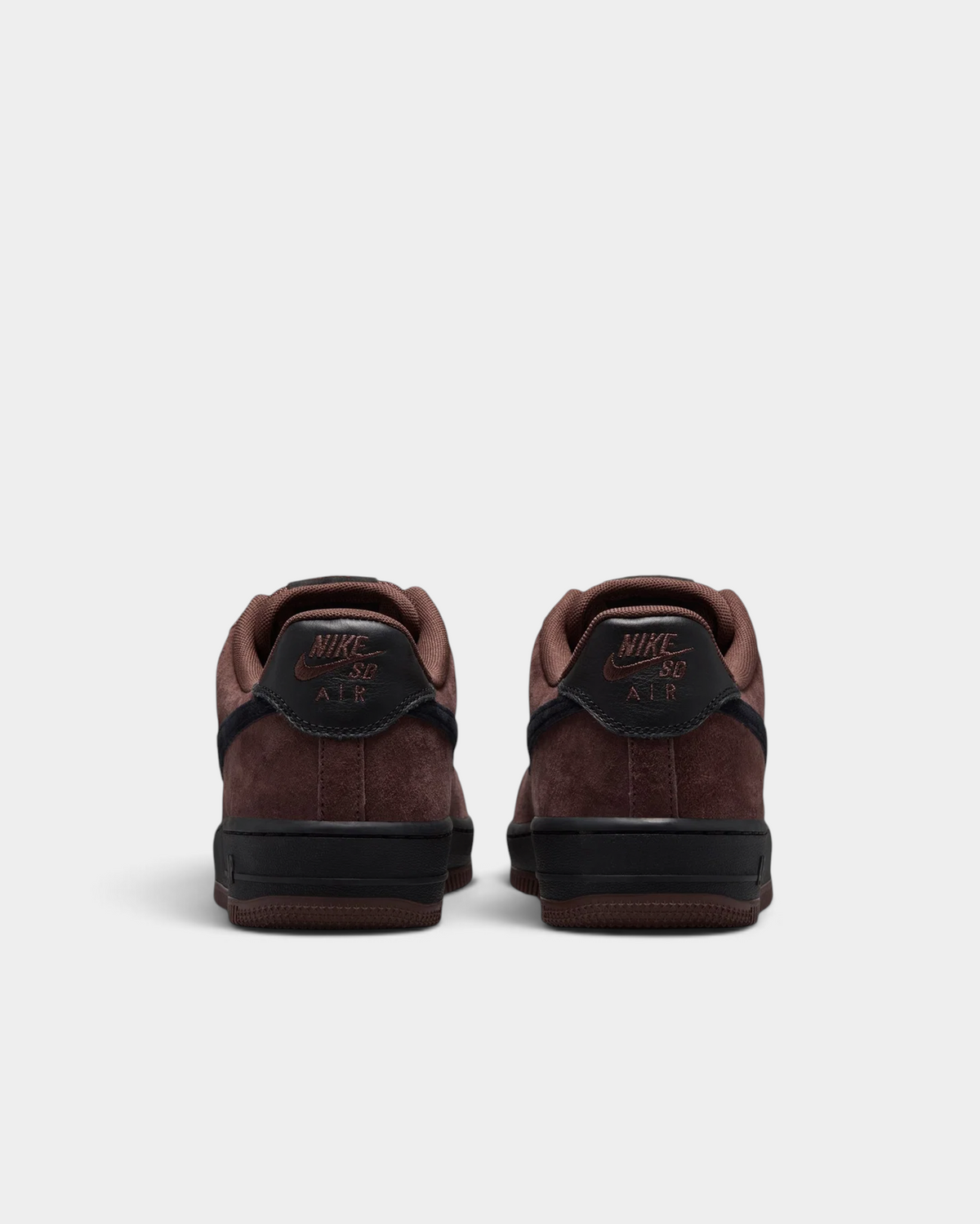 Lockwood Avenue Nike SB Air Force 1 Light Chocolate skate shoes from behind, black heel tabs with Nike Air branding above the brown suede heel