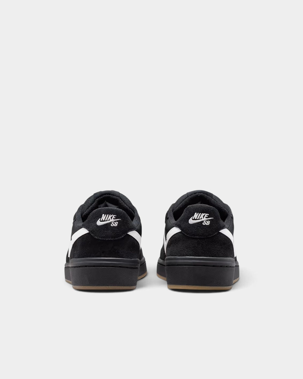 Lockwood Avenue Nike SB Code 58 skate shoes in black suede with white swoosh and gum rubber outsole, rear view.