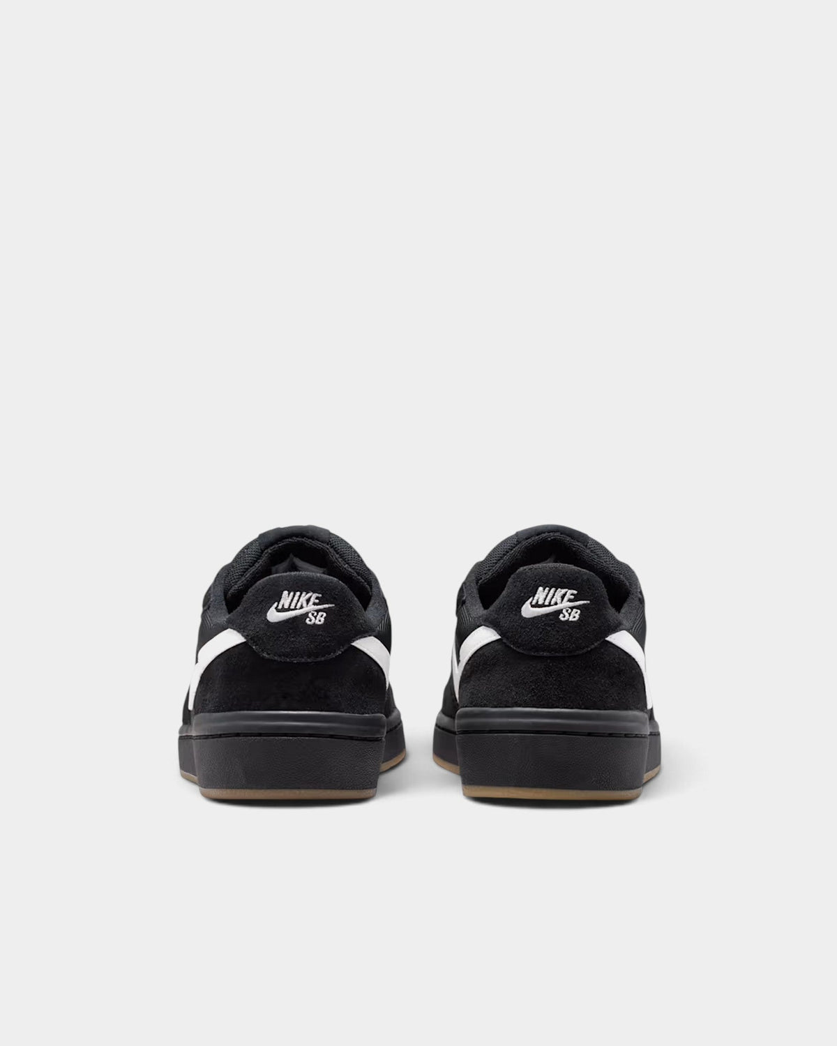 Lockwood Avenue Nike SB Code 58 skate shoes in black suede with white swoosh and gum rubber outsole, rear view.