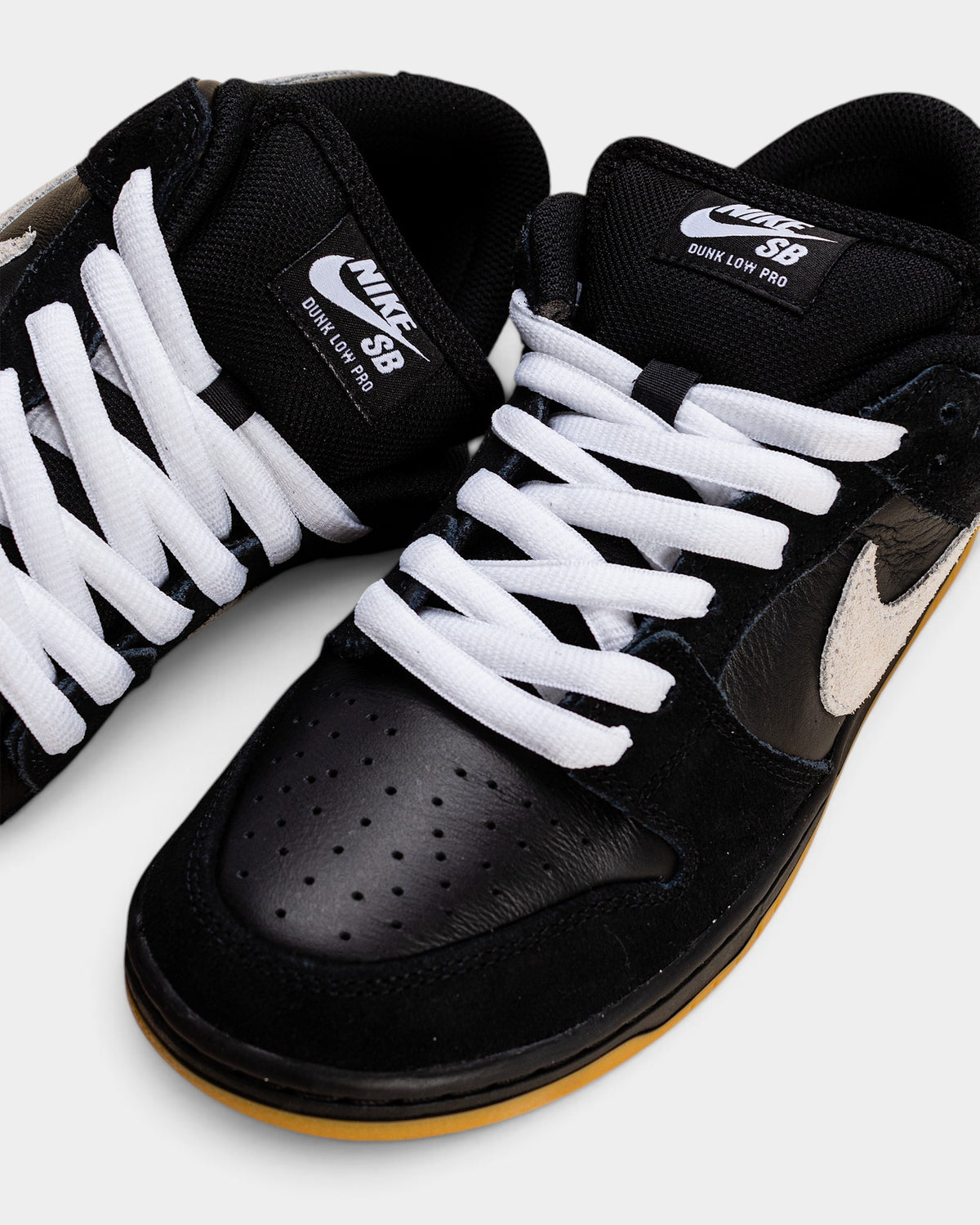 Nike SB Dunk Low Pro Shoes - Black / White / Gum