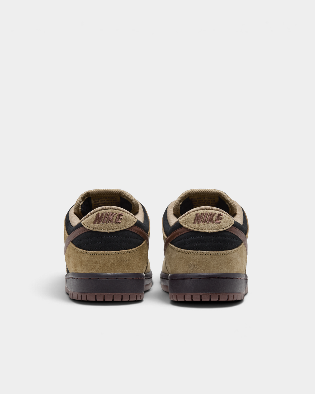 Nike SB Dunk Low Pro Shoes in Filbert/Light Chocolate/Black/Burgundy Ash, the pair from behind: brown embroidered Nike heel tabs and black padded collars over a dark brown sole