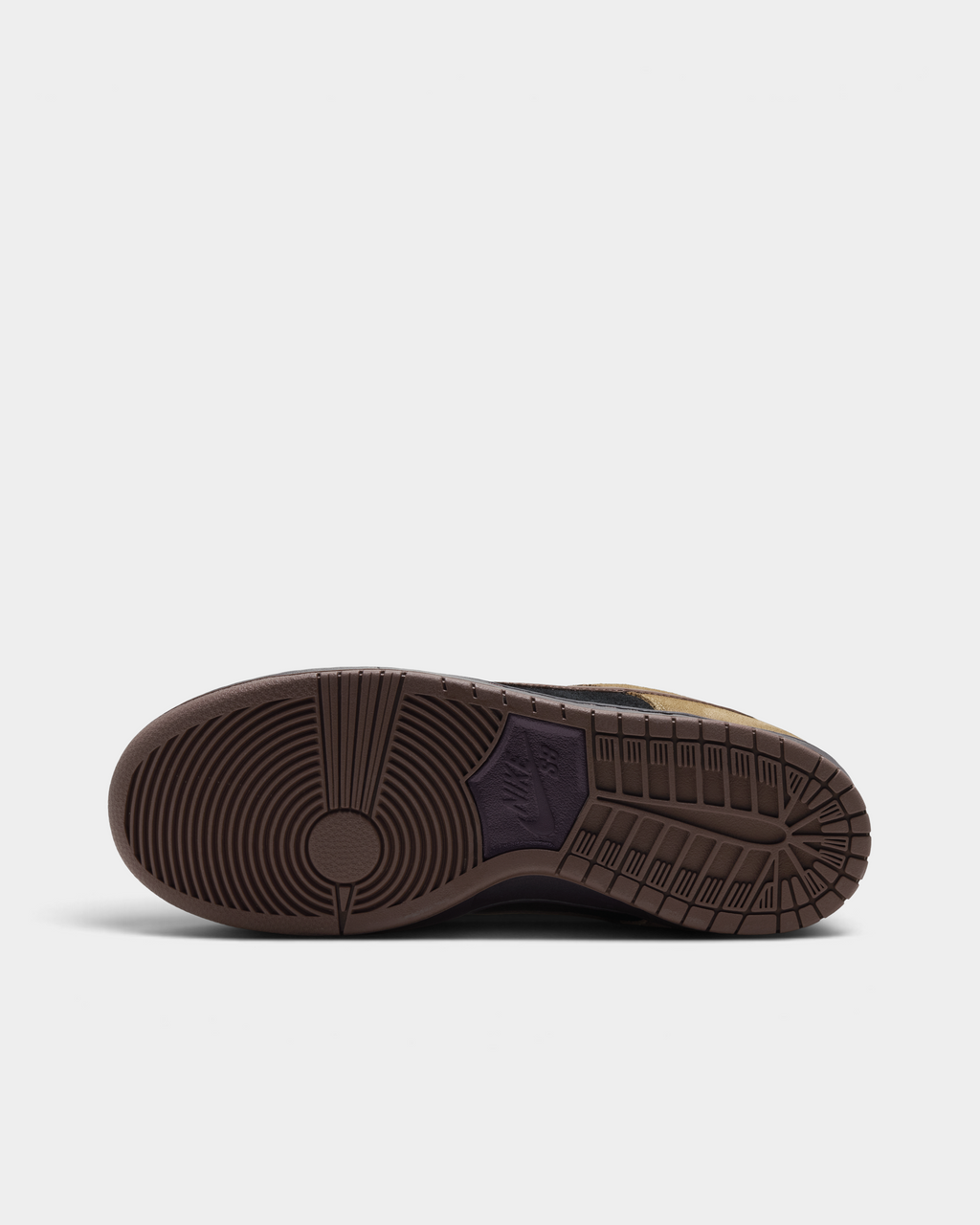 Nike SB Dunk Low Pro Shoes in Filbert/Light Chocolate/Black/Burgundy Ash, the outsole: brown rubber with the classic pivot circle at the forefoot and a herringbone tread