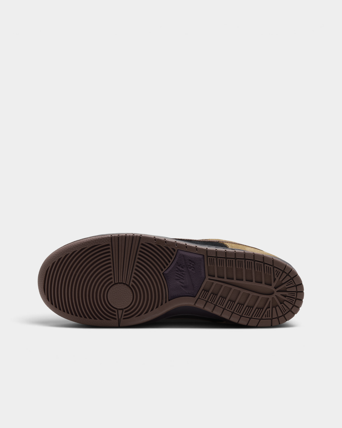 Nike SB Dunk Low Pro Shoes in Filbert/Light Chocolate/Black/Burgundy Ash, the outsole: brown rubber with the classic pivot circle at the forefoot and a herringbone tread