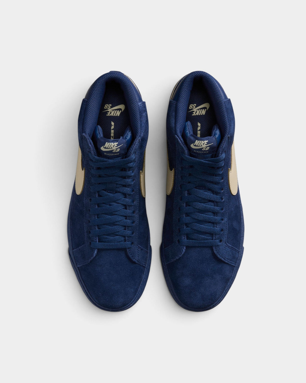 Lockwood Avenue Nike SB Zoom Blazer Mid navy blue suede skate shoes with gold swoosh logo, top-down view.