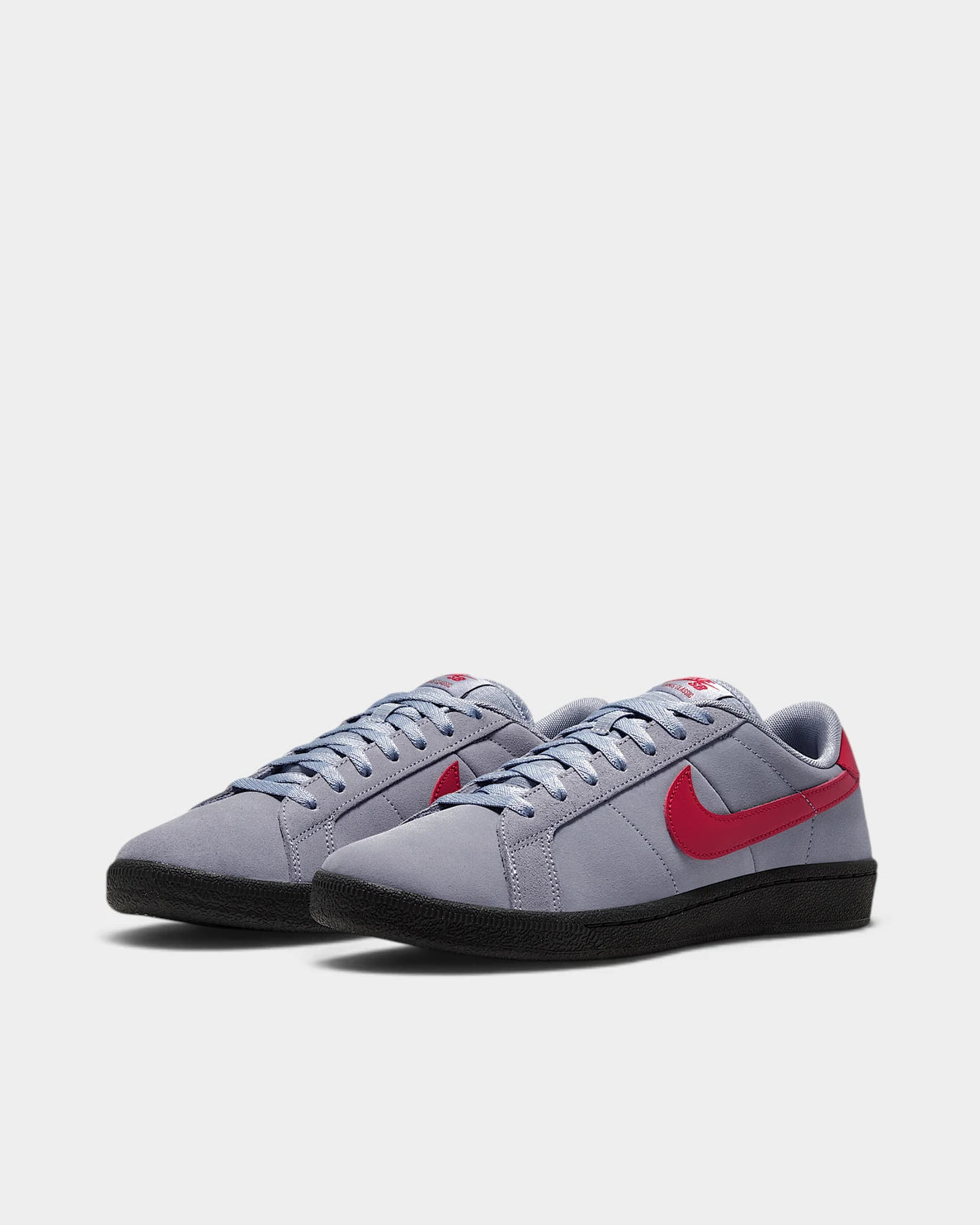 Nike SB Zoom Tennis Classic Shoes in Stealth/Gym Red/Black, both shoes from a three-quarter front angle, showing the slate blue-grey suede upper with a red Swoosh and heel tab on a black sole