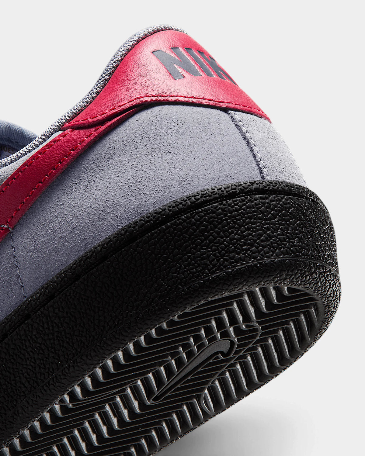 Nike SB Zoom Tennis Classic Shoes in Stealth/Gym Red/Black, close-up of the red heel tab and the black sole edge