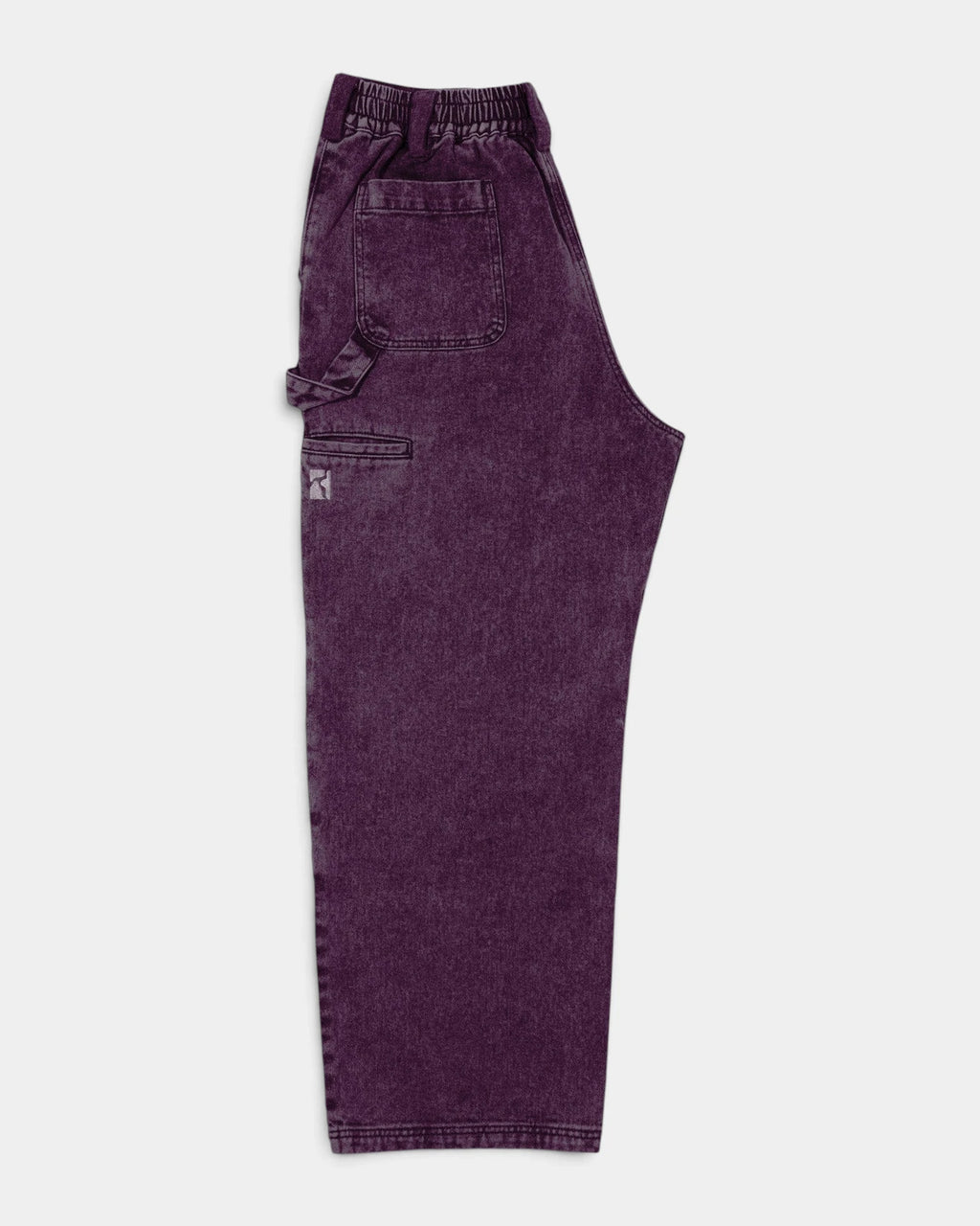 Lockwood Avenue Poetic Collective Sculptor Pants in Purple Acid Denim Wash seen from the side, showing the hammer loop and the utility pocket on the leg