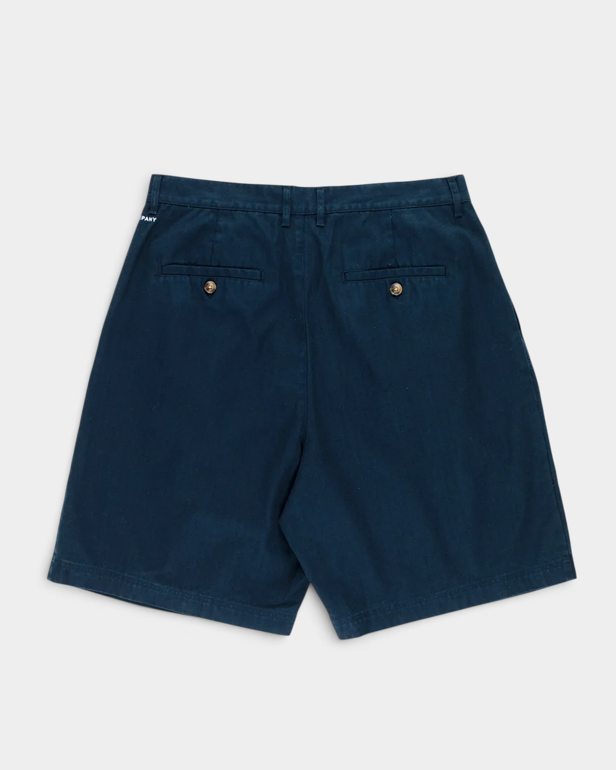 Pop Trading Company Boat Shorts in navy, flat lay back view showing two welt pockets with tortoise button closures and the embroidered logo at the waistband