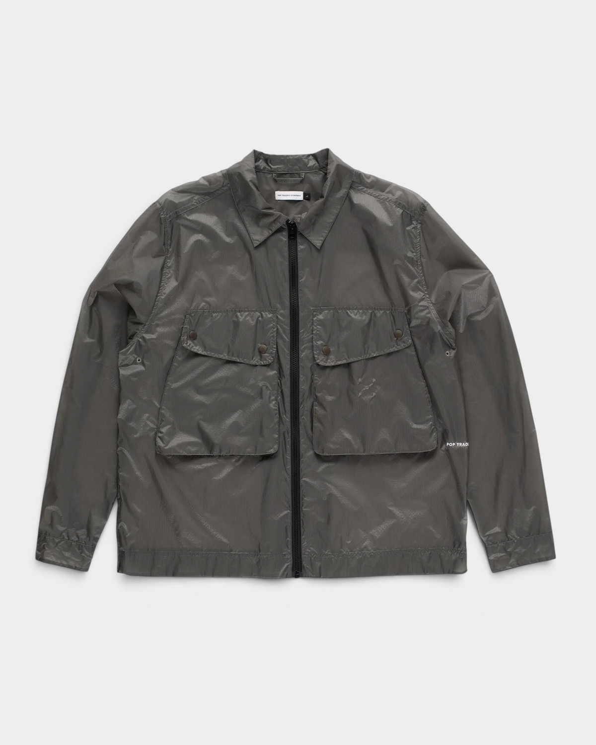 POP Trading Company Box overshirt in charcoal ripstop nylon with a full zip, a camp collar and two flap chest pockets