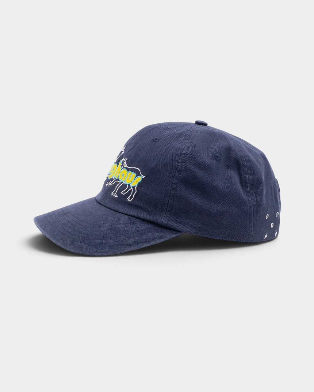 Pop Trading Company x Berghaus Berggoat six panel cap in navy, side, with the goats and berghaus embroidery and the small Pop logo near the back