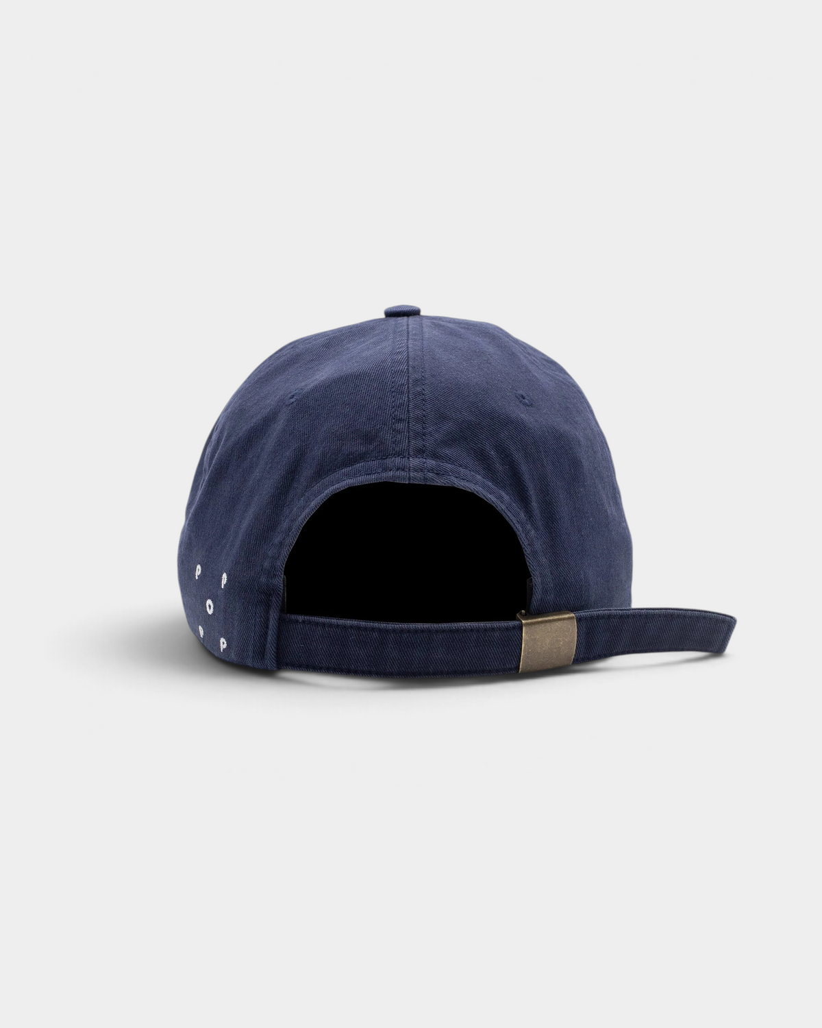 Pop Trading Company x Berghaus Berggoat six panel cap in navy, back, plain, with a metal buckle strap and the small Pop logo on the side
