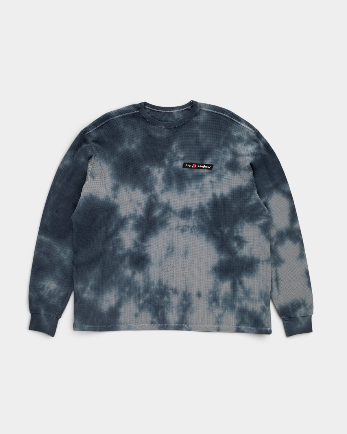 Pop Trading Company x Berghaus waffle long-sleeve t-shirt in navy, front, in a slate blue and grey tie-dye with a small pop berghaus label on the chest