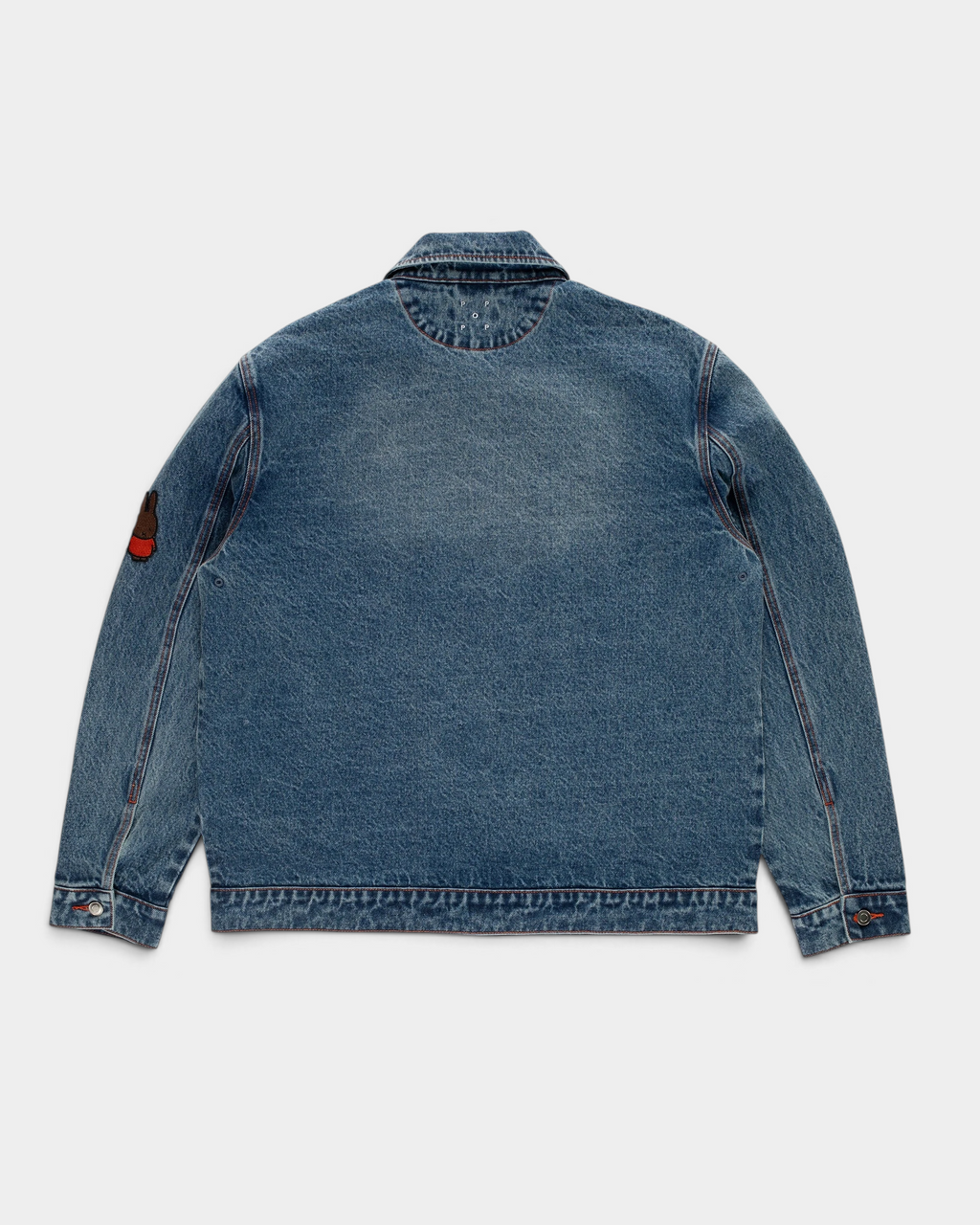 Pop Trading Company x Miffy full button denim jacket in stonewashed blue, back, with a small patch on the sleeve