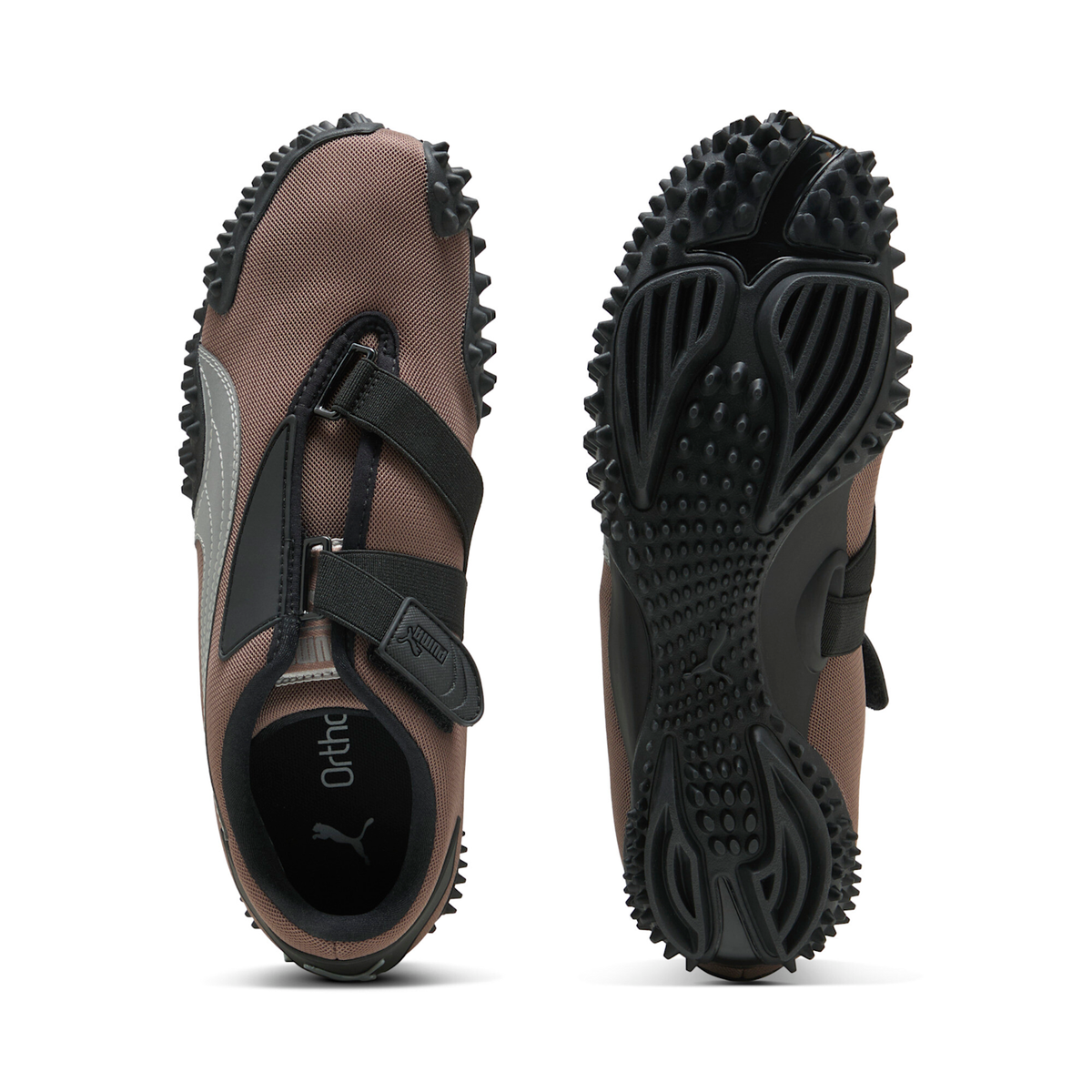 Puma Mostro OG in Dark Clove, one shoe from above showing the strap layout and the OrthoLite sockliner, beside the other turned over to show the spiked outsole tread