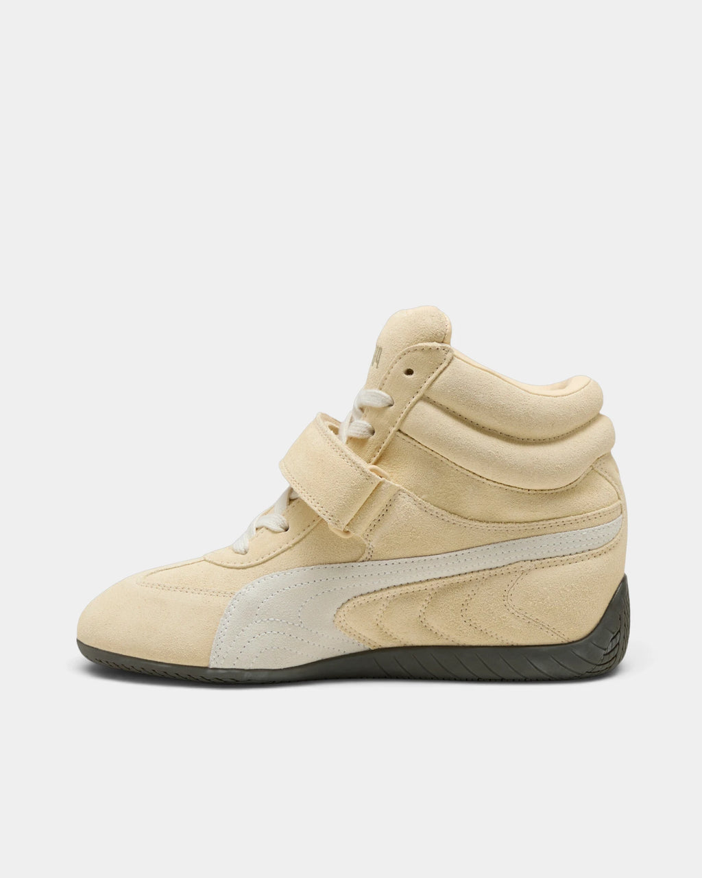 Puma Speedcat Wedge Shoes in Buttercream/Gum, right shoe from the inner side, toe pointing left, showing the cream suede upper with a white formstrip, hook-and-loop ankle strap and a dark gum sole