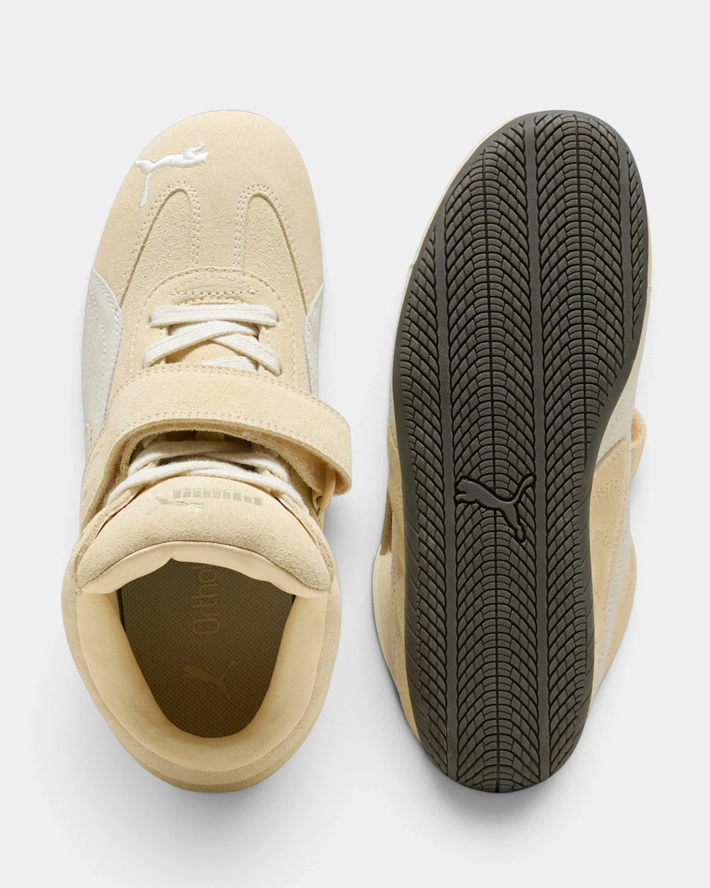 Puma Speedcat Wedge Shoes in Buttercream/Gum, one shoe from above beside the tread of the outsole, showing the cream suede upper with a white formstrip, hook-and-loop ankle strap and a dark gum sole