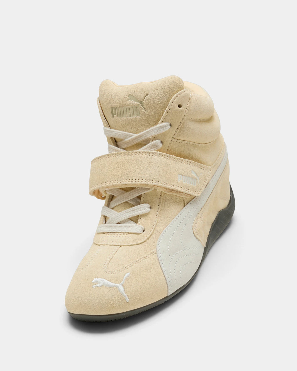Puma Speedcat Wedge Shoes in Buttercream/Gum, right shoe from a raised three-quarter angle, showing the cream suede upper with a white formstrip, hook-and-loop ankle strap and a dark gum sole