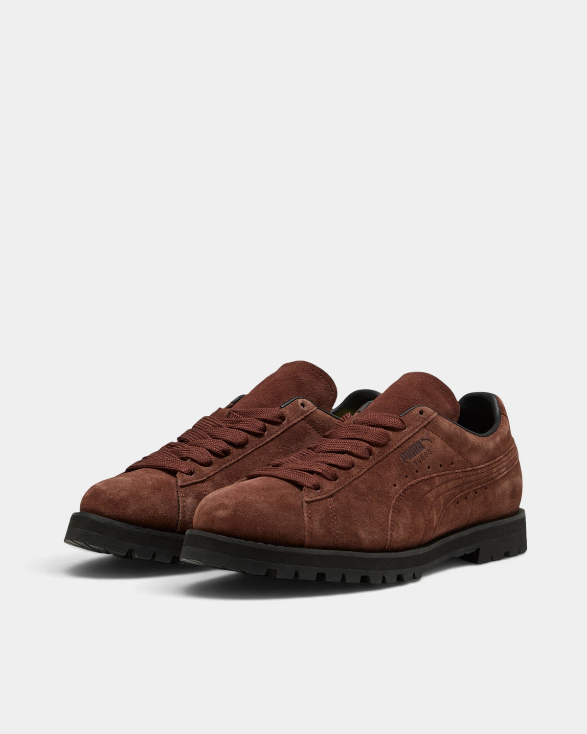 Puma Suede Vibram Shoes in Chocotart/Puma Black, both shoes from a three-quarter front angle, showing the chocolate brown suede upper on a black lugged Vibram outsole