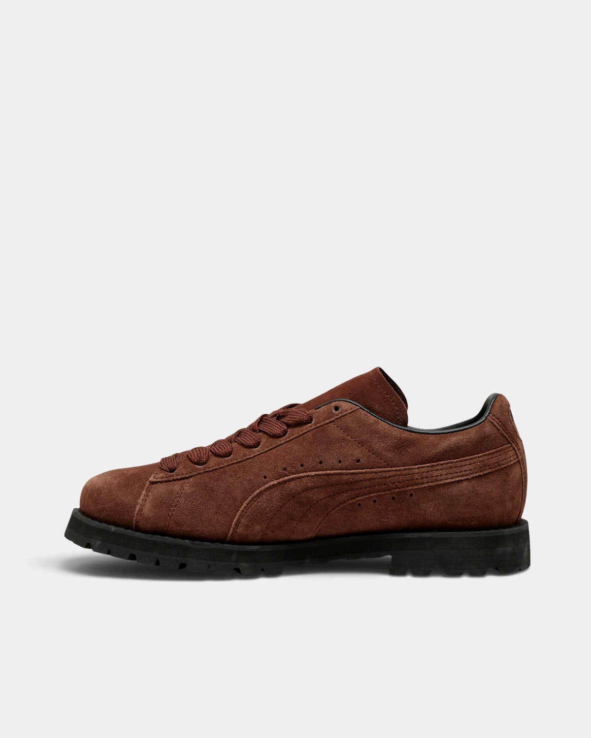 Puma Suede Vibram Shoes in Chocotart/Puma Black, right shoe from the inner side, toe pointing left, showing the chocolate brown suede upper on a black lugged Vibram outsole