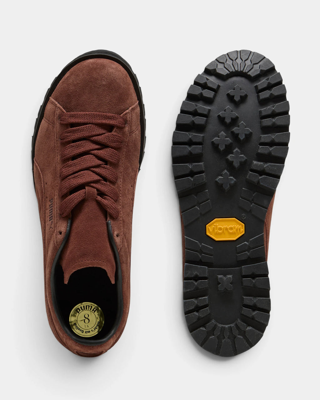 Puma Suede Vibram Shoes in Chocotart/Puma Black, one shoe from above beside the tread of the outsole, showing the chocolate brown suede upper on a black lugged Vibram outsole
