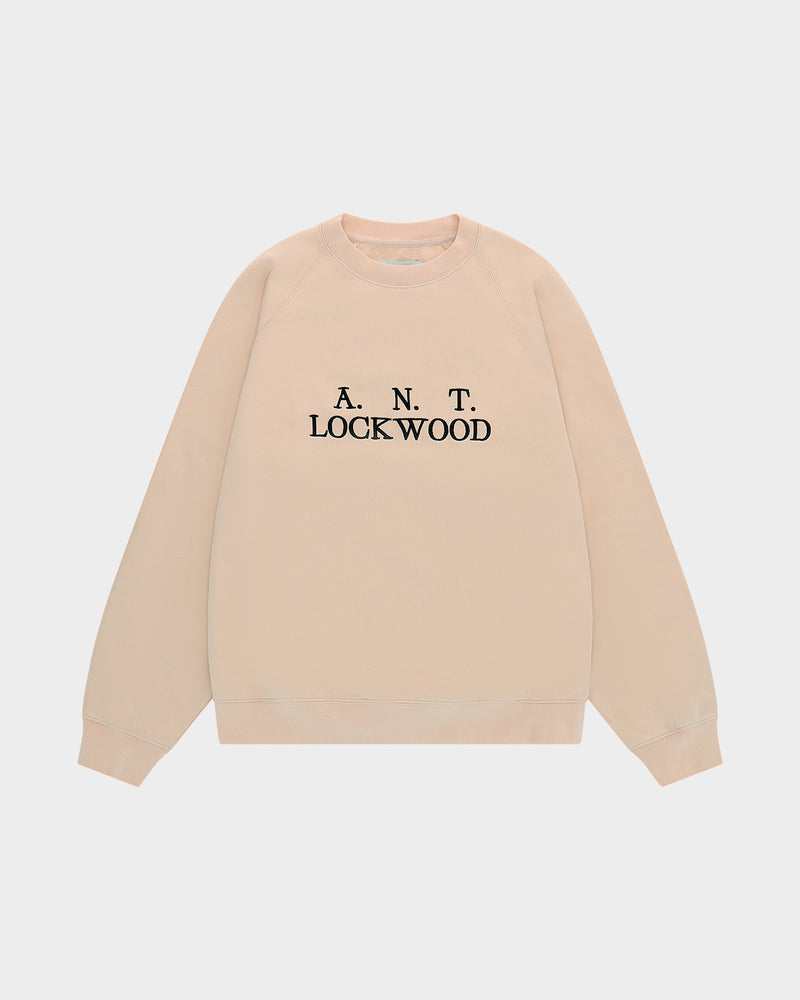 Lockwood Initials Antwerp Crewneck Sweatshirt in Tan, flat-lay front with the A.N.T. Lockwood logo embroidered in black on the chest