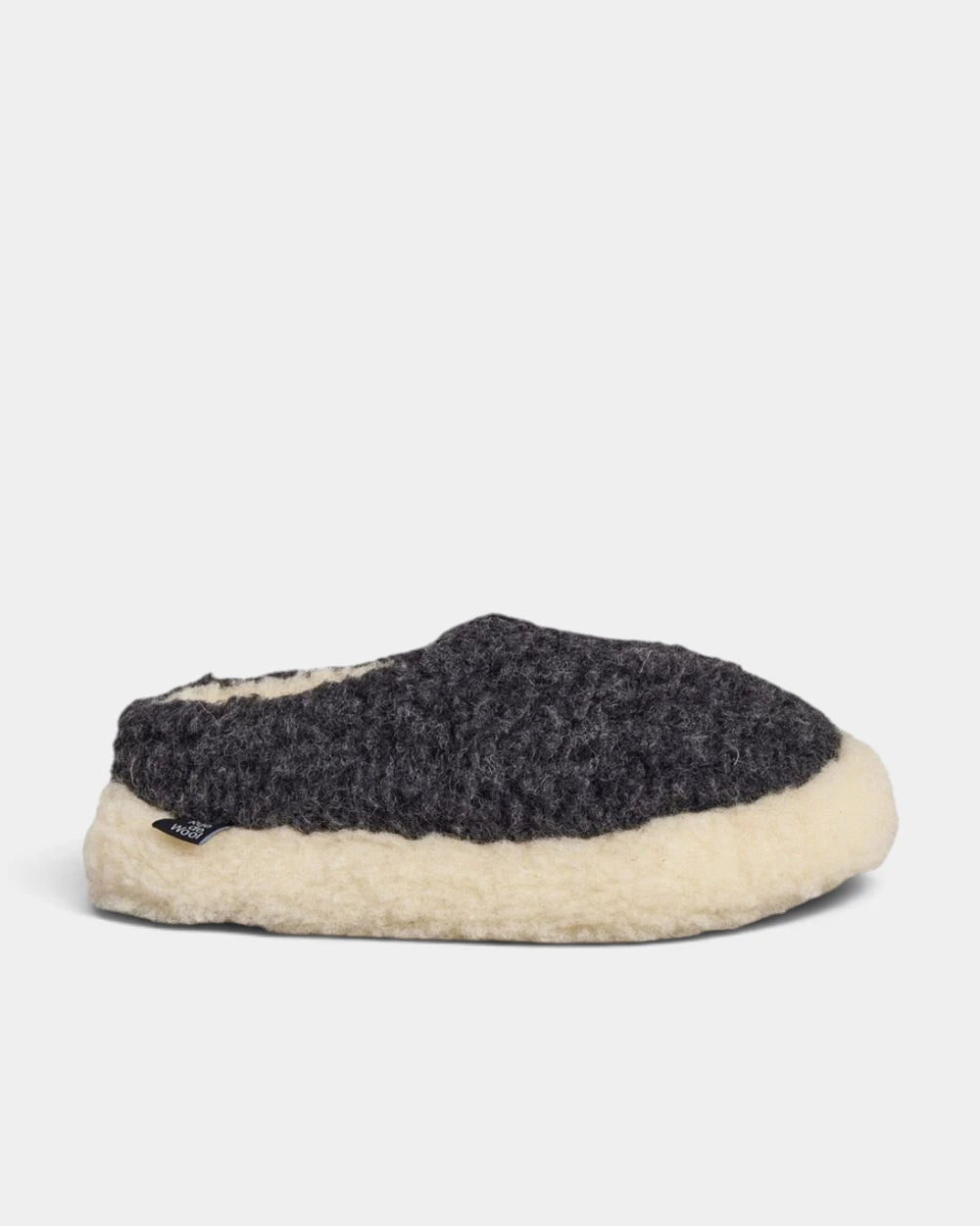 Rue De Wool The Nordic V2 slipper in charcoal black curly wool with a natural wool rim, side view