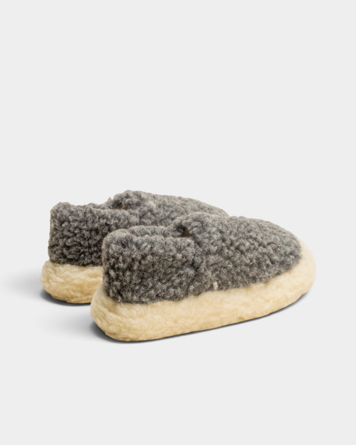 A pair of Rue De Wool The Nordic V2 slippers in iron grey, rear view showing the low wool heel