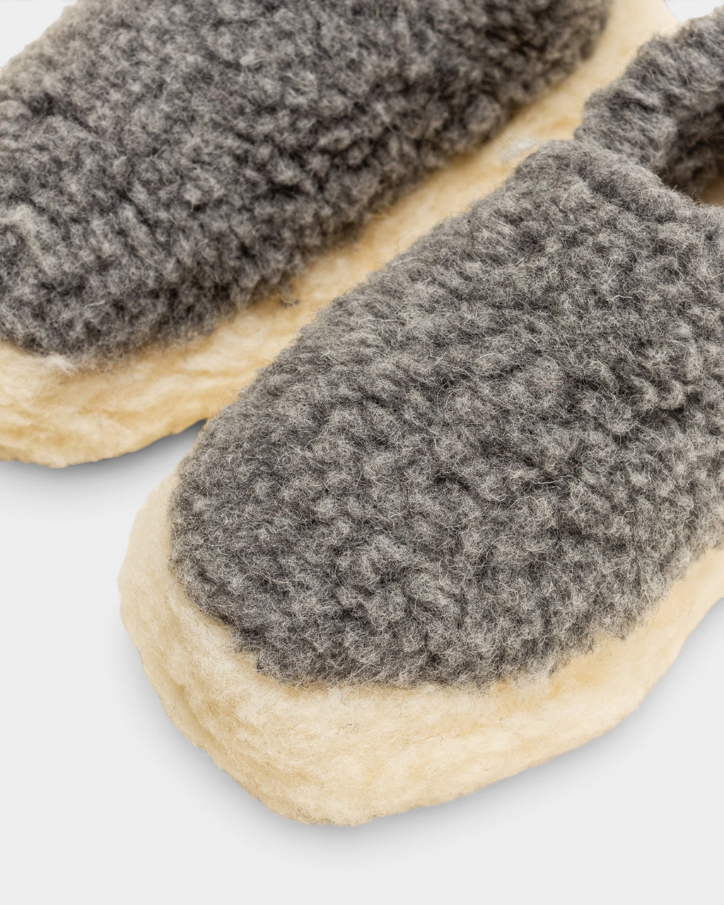 Close-up of the iron grey curly wool upper and natural wool rim of the Rue De Wool The Nordic V2