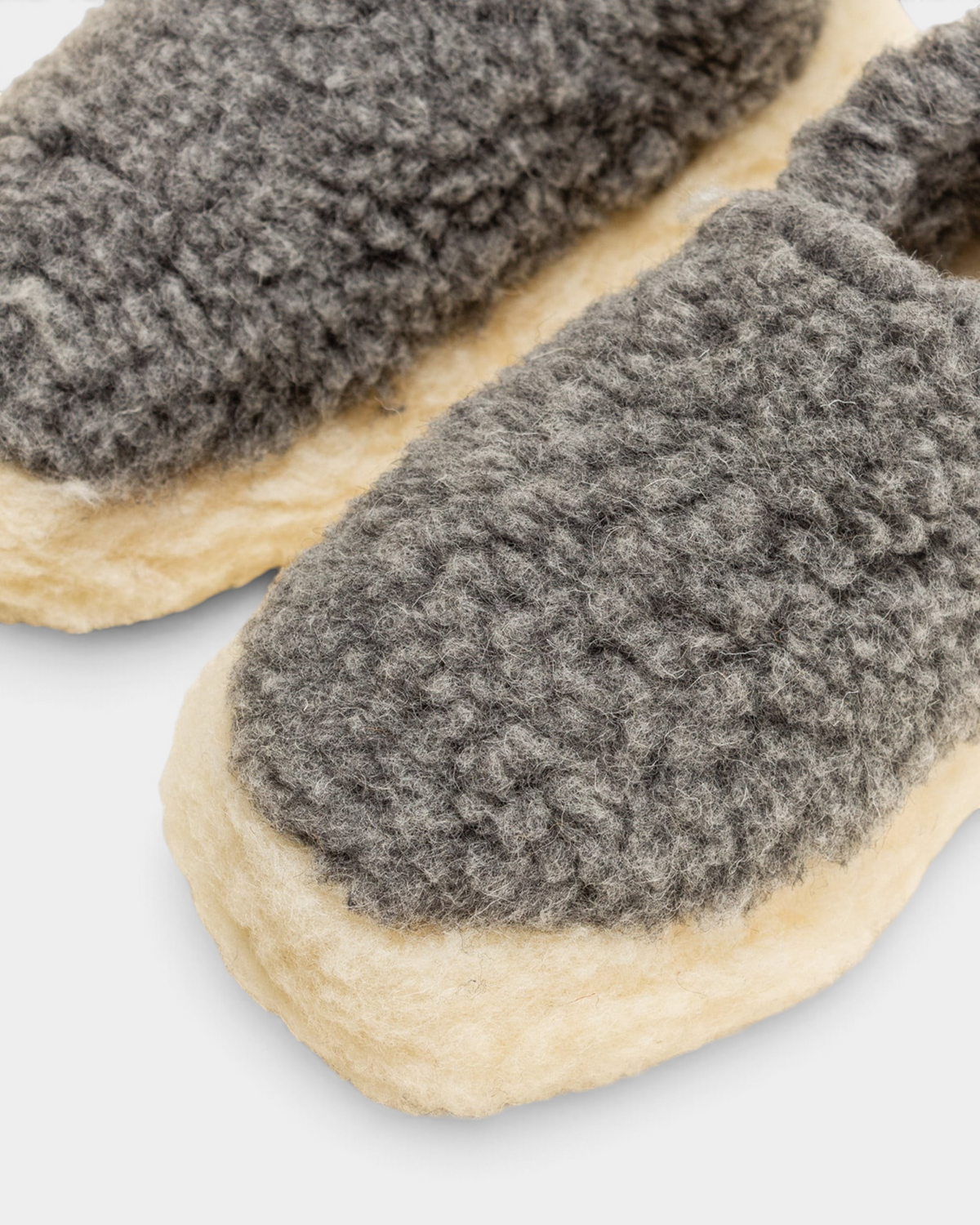 Close-up of the iron grey curly wool upper and natural wool rim of the Rue De Wool The Nordic V2