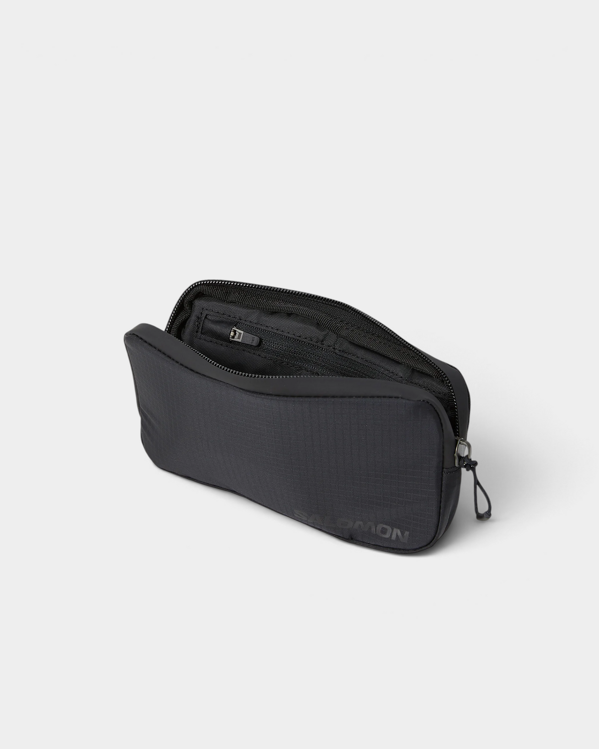 Salomon ACS Essentials Case in black, shown open at an angle with the zip drawn back to reveal the lined interior and its zipped inner pocket