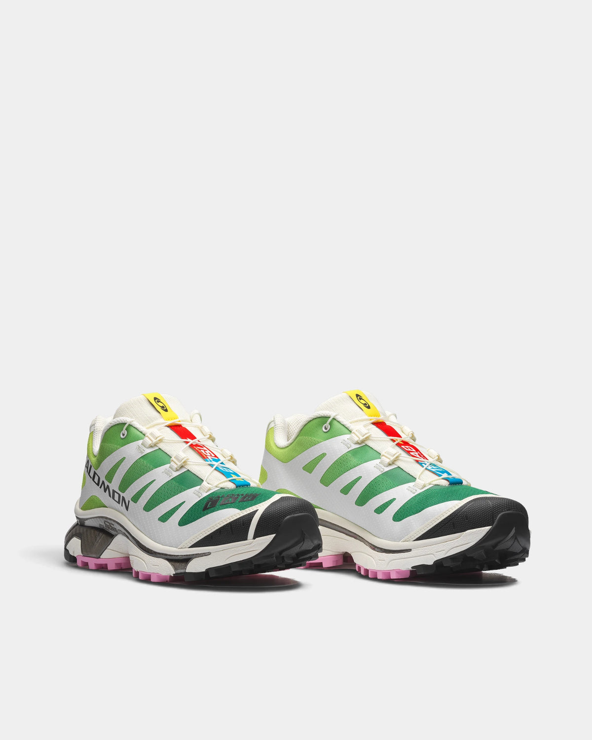 Salomon XT-4 OG Shoes in Vanilla Ice/Acid Lime/Pink Frosting, both shoes from a three-quarter front angle, showing the off-white and green mesh upper with pink accents on a chunky sole