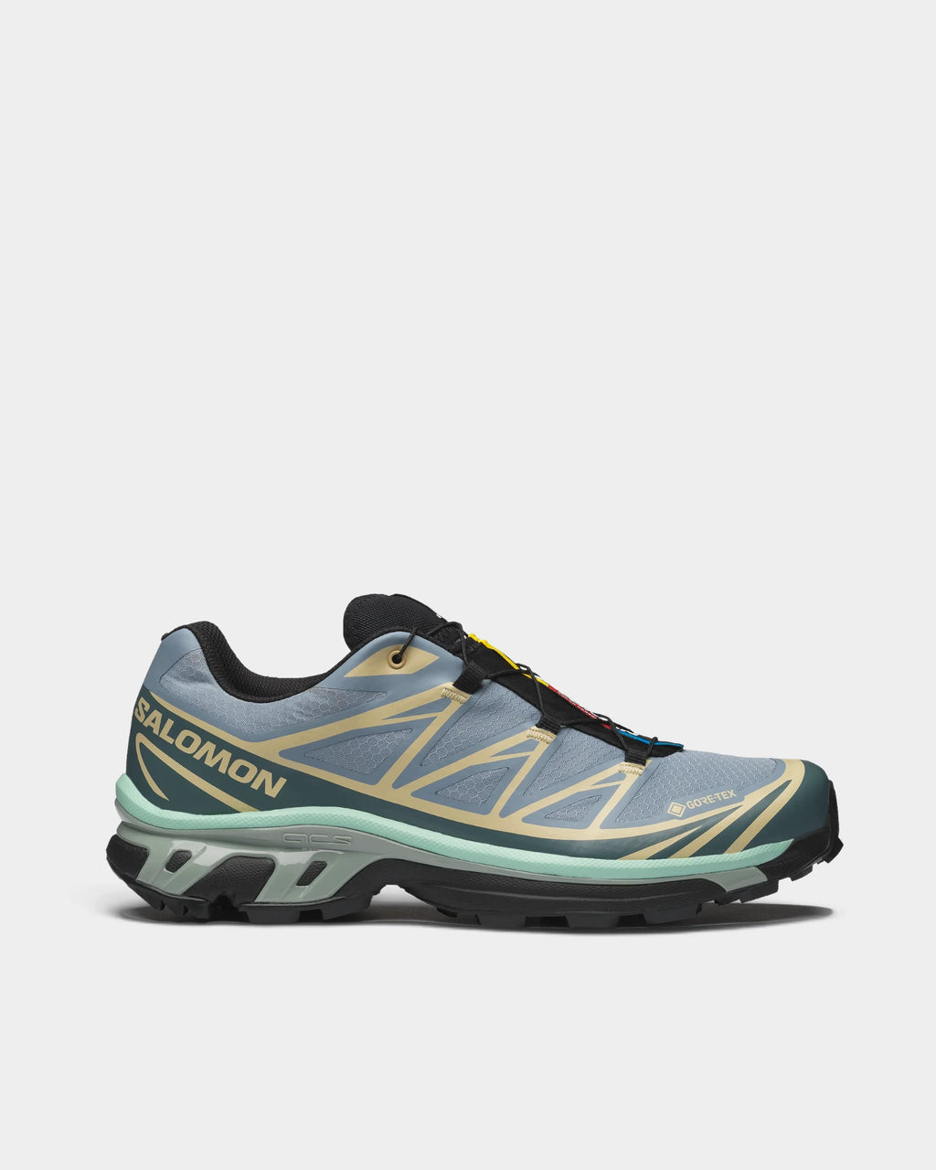 Salomon XT-6 Gore-Tex Shoes in Tradewinds/Stormy Weather/Bog, right shoe in side profile, showing the light blue-grey upper with sand overlays and dark green accents on a black sole