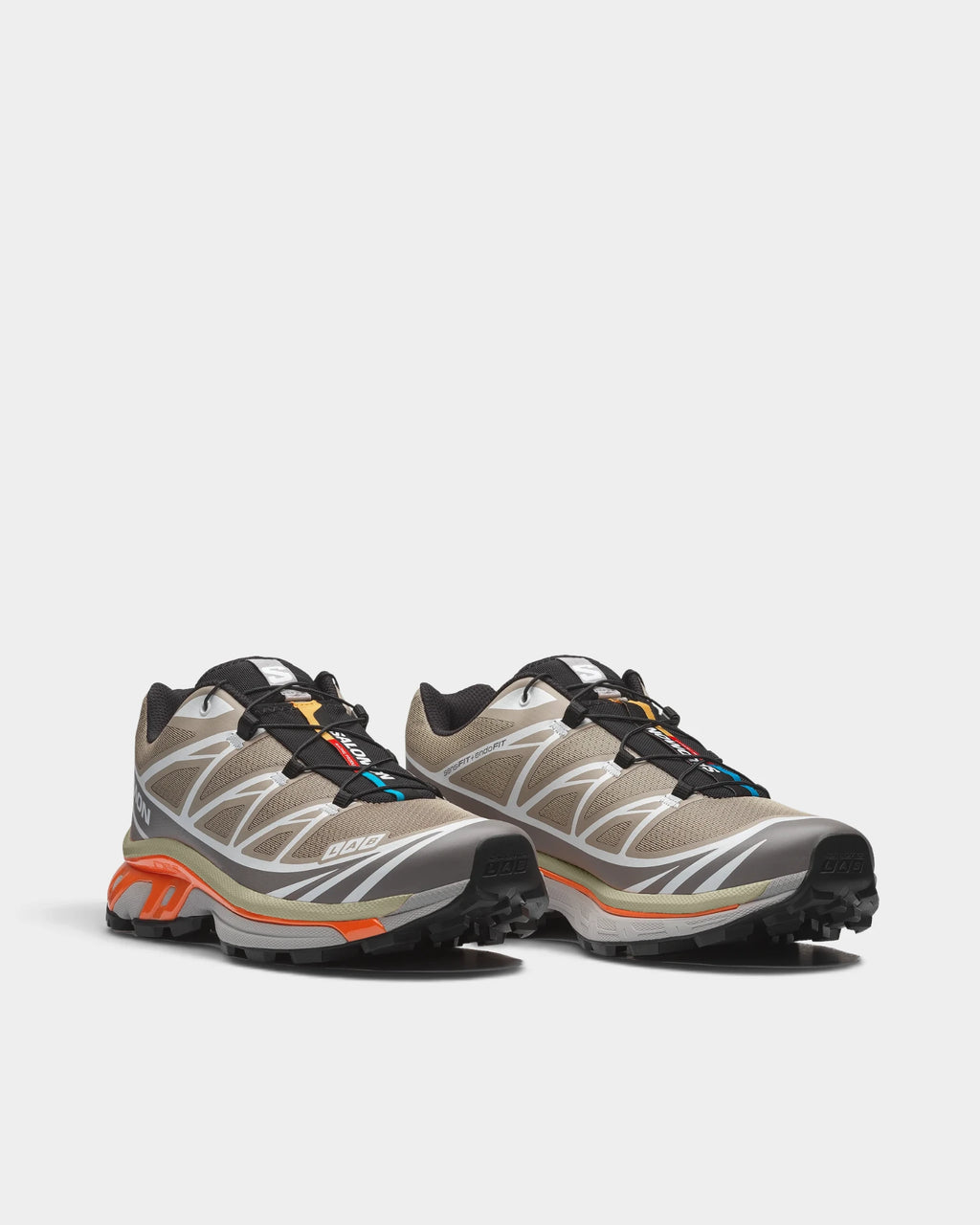 Salomon XT-6 Shoes in Silver Sage/Cloudburst/Dragon Fire, both shoes from a three-quarter front angle, showing the sand and silver mesh upper with white overlays on a grey and orange sole