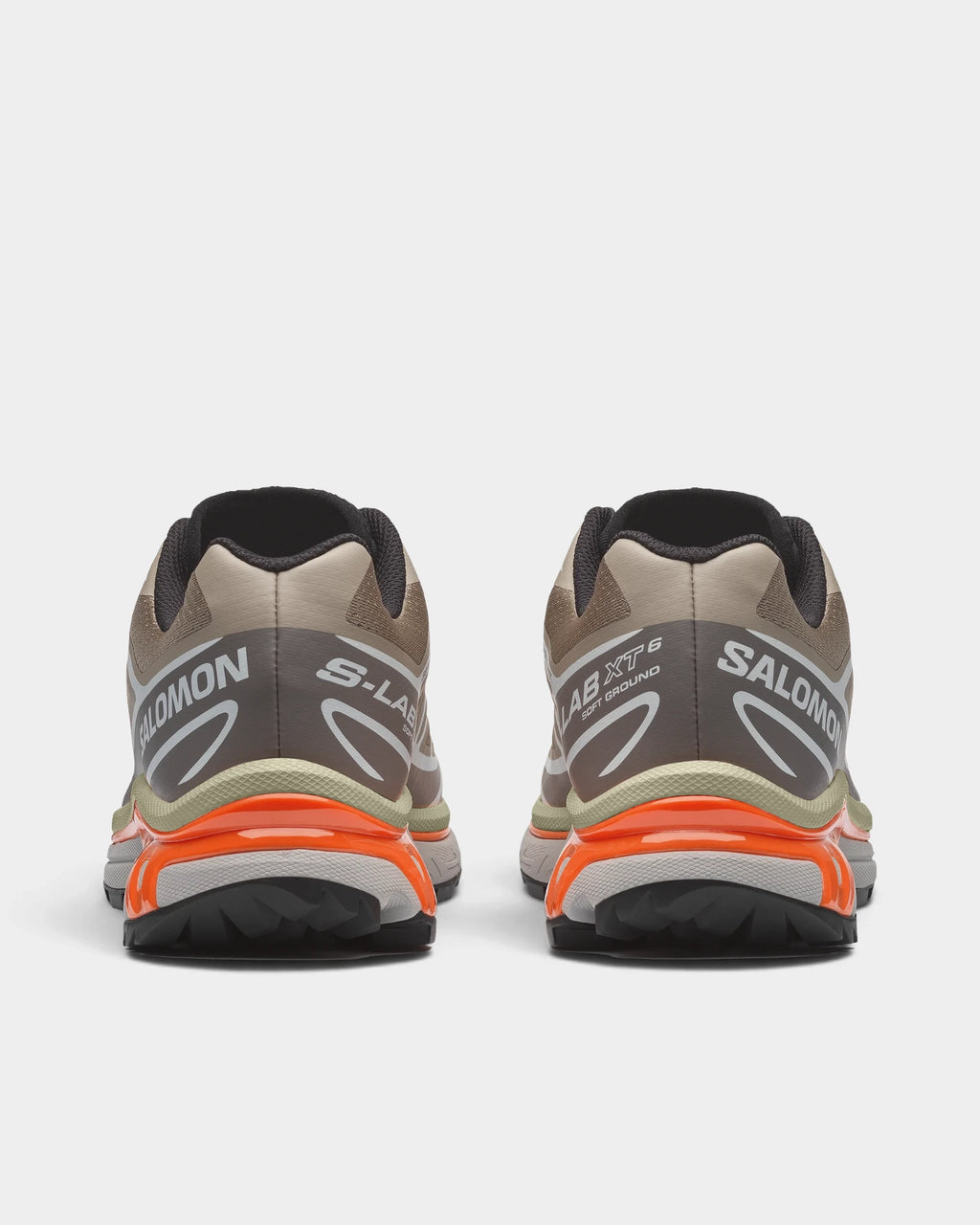 Salomon XT-6 Shoes in Silver Sage/Cloudburst/Dragon Fire, both shoes from behind, showing the sand and silver mesh upper with white overlays on a grey and orange sole