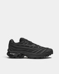 Salomon XT-EVO Shoes in Black/Black/Asphalt, right shoe in side profile, showing the all-black layered upper on a black sculpted sole