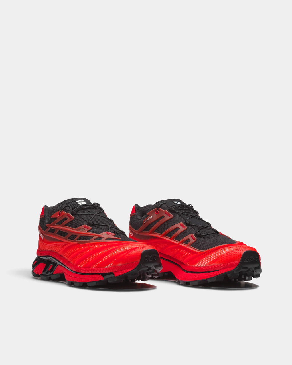 Salomon XT-EVO Shoes in Black/Fiery Red/White, both shoes from a three-quarter front angle, showing the black and red layered upper on a red and black sculpted sole