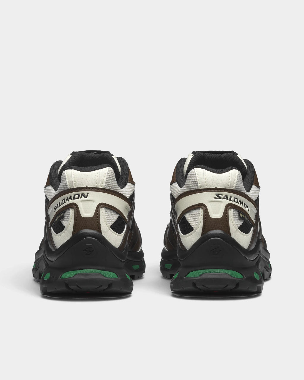 Salomon XT-Quest Gore-Tex Shoes in Black/Delicioso/Green Jacket, both shoes from behind, showing the black and brown upper with off-white panels on a black sole with green accents