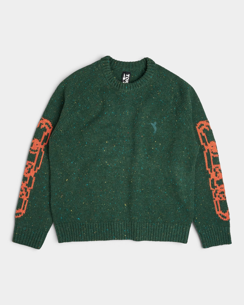 Lockwood Avenue Token Chains sweater, a flecked dark green chunky knit with orange chain jacquard on the sleeves, front view laid flat