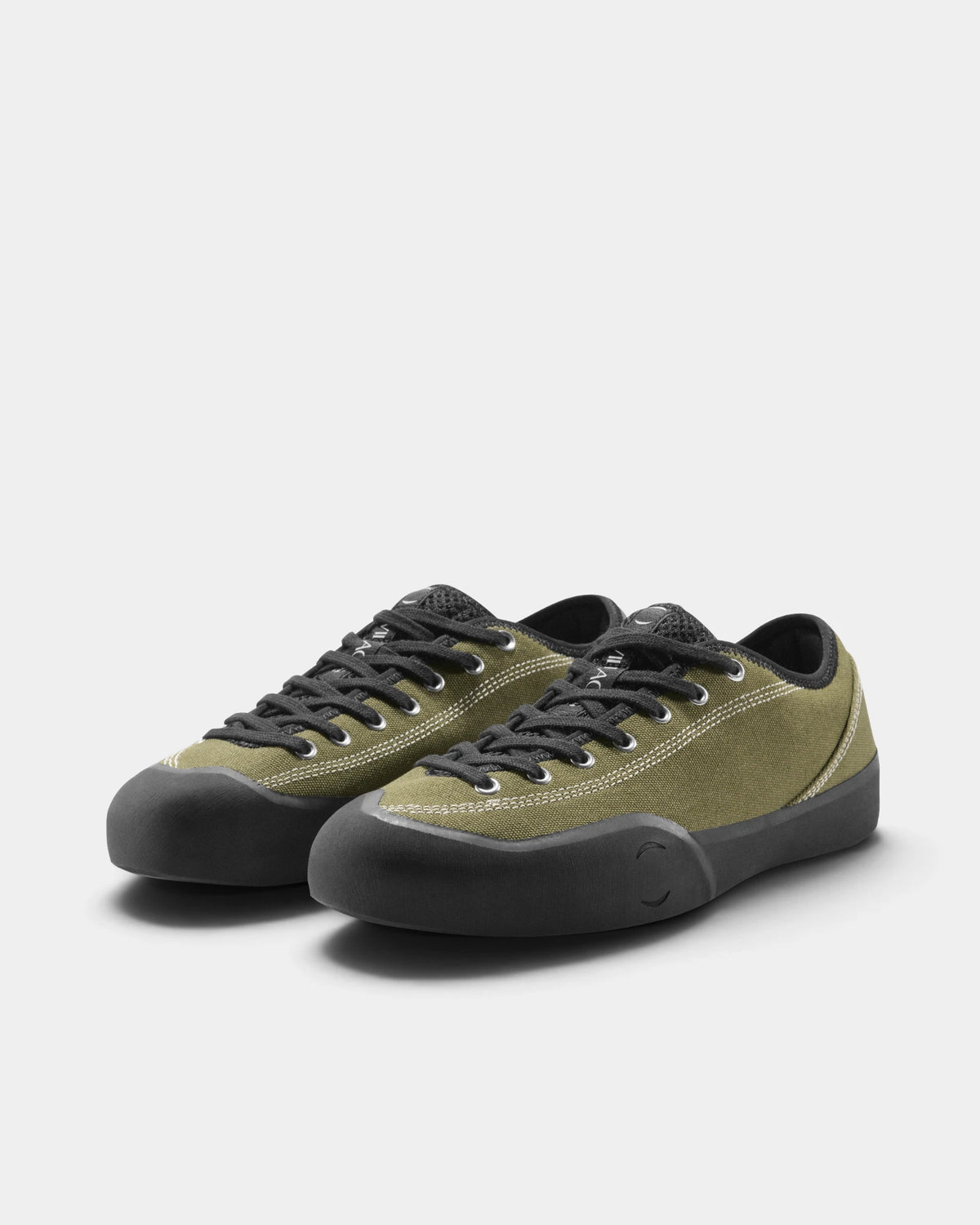 Village PM 1.30PM Canvas Shoes in Olive/Natural Black: the pair seen from the front three-quarter angle, toes to the right. A olive canvas low-top skate shoe on a natural black gum outsole.