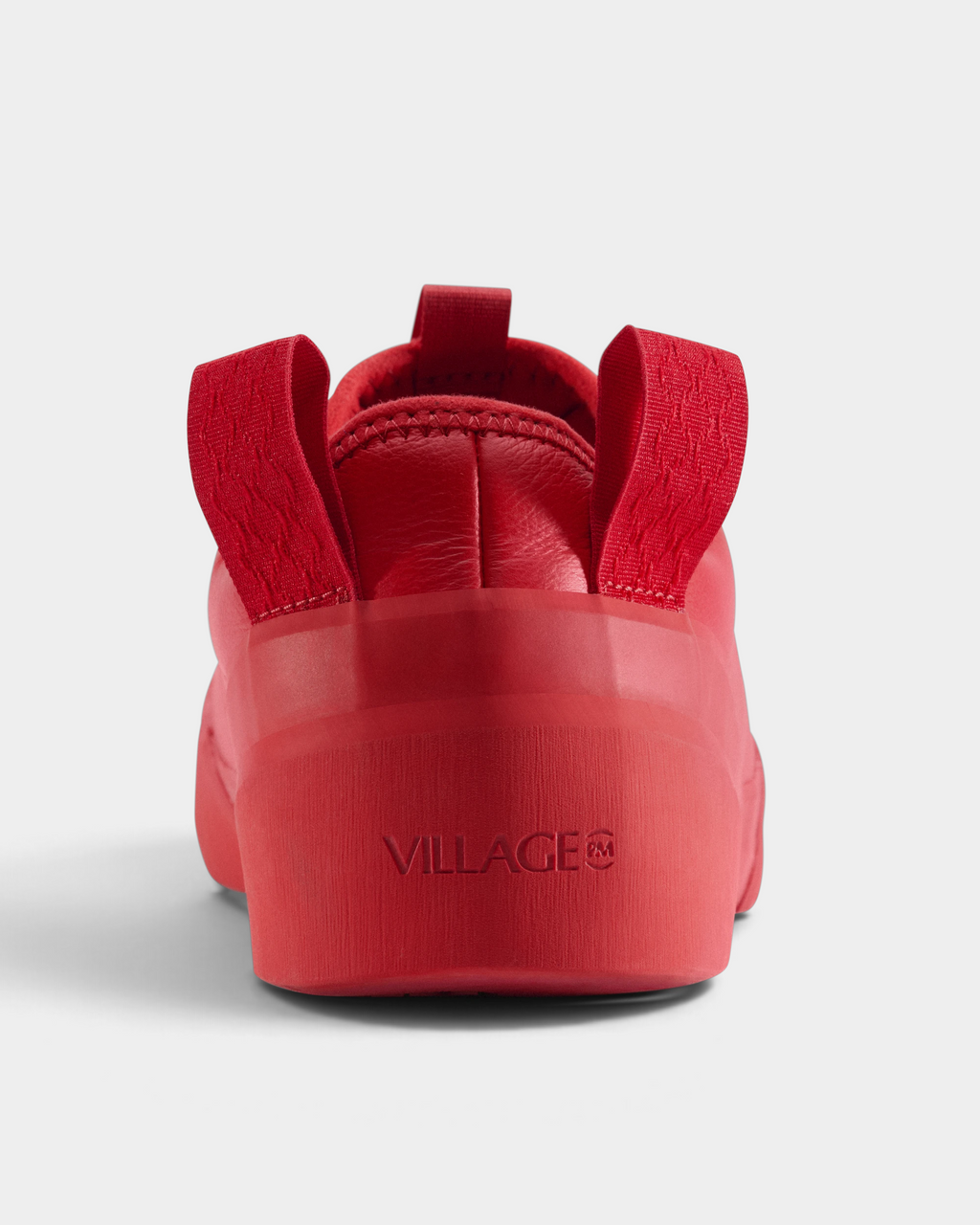 Village PM 1PM Full Grain Leather Shoes in Red: an all red full grain leather low-top skate shoe with red laces and a red sole, seen from behind, the heel and the pull tabs