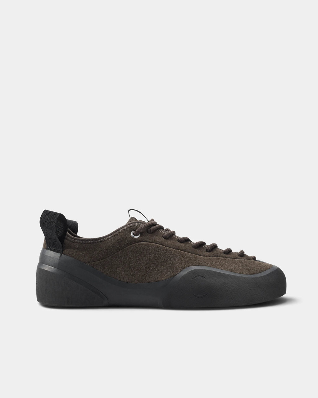 Village PM 1PM Leather Suede Shoes in Chocolate/Natural Black: a single shoe seen side on, toe to the right. A chocolate brown suede low-top skate shoe on a natural black gum outsole.
