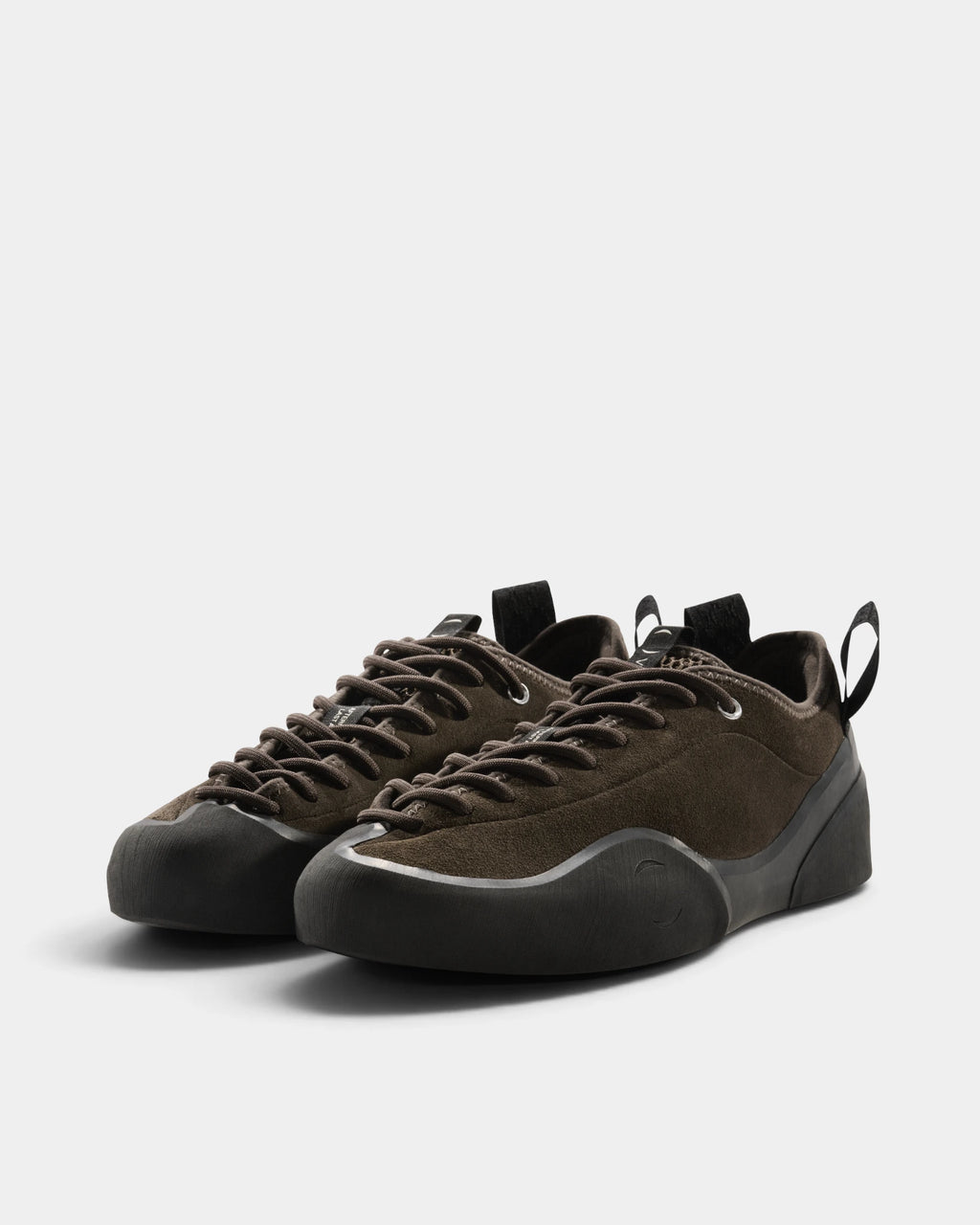 Village PM 1PM Leather Suede Shoes in Chocolate/Natural Black: the pair seen from the front three-quarter angle, toes to the right. A chocolate brown suede low-top skate shoe on a natural black gum outsole.